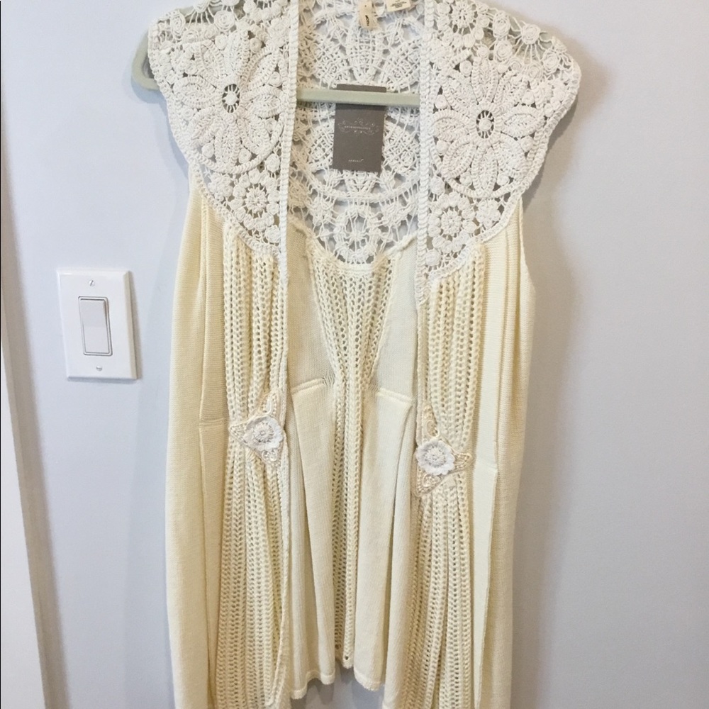 Sleeveless crocheted Anthropologie sweater.